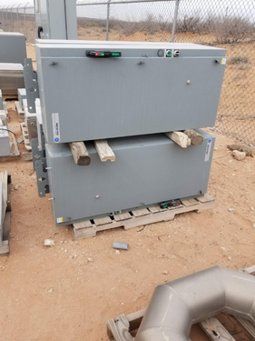 electrical surplus buyer in West Palm Beach FL evaluating an enclosed transformer