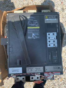 electrical surplus buyer in Pflugerville TX reviewing a large-frame circuit breaker